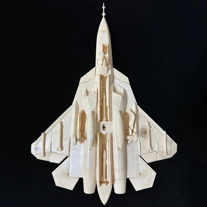 A composite model of the SU-57 mammoth tusk aircraft on a stand